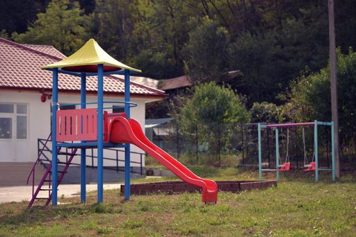 A playground for children on the yard of a primary school in a village