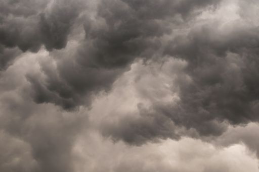 A dark sky with heavy clouds accu