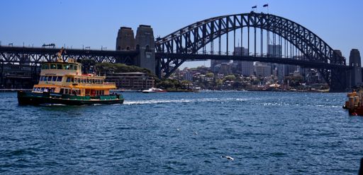 Sydney ferry heading toward Circular Quay with the Sydney Harbour Bridge in the background
