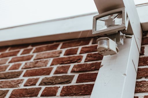 A low angle shot of a motion sensor lamp