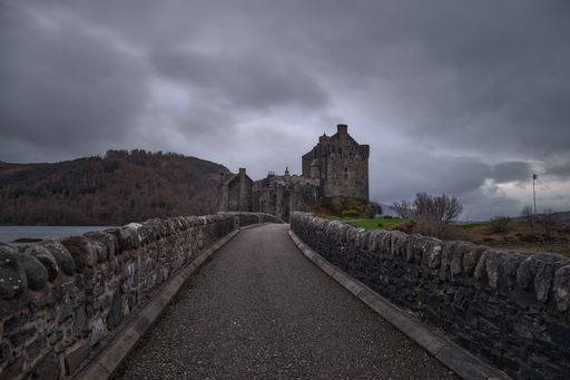 The medieval castle on the Eilean Donan island under the gloomy sky