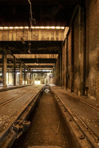 A vertical shot an abandoned warehouse where trains were repaired in the past