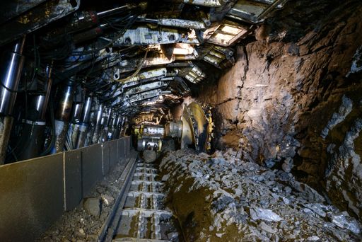 Longwall Mining: Shearer, with two rotating cutting drums and movable hydraulic powered roof supports called shields