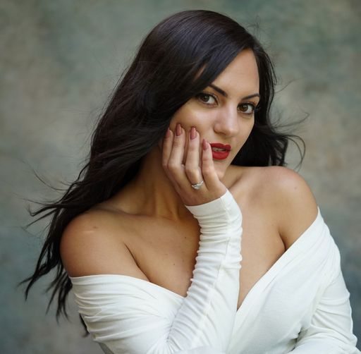 A shallow focus shot of an attractive female posing at camera