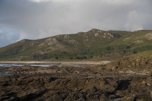 A beautiful shot of the mountain landscapes on the Coast of Carnota, Galicia, Spain