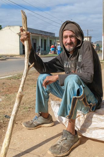 A vertical shot of a herdsman having a rest outdoors