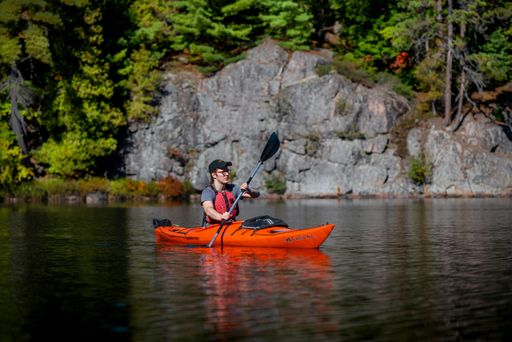 Single male kayaker paddling in Carlyle, Johnnie and Terry Lakes.