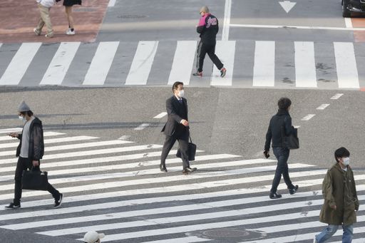 Tokyo, Japan, April 7, 2020 - Pedestrians wear face masks as a preventive measure during the new coronavirus outbreak at Shibuya's scramble crossing.