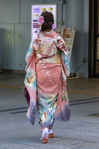 January 13, 2020, Tokyo, Japan - A Japanese girl dressed in a colorful kimono is seen on the street during the Coming of Age Day celebration.