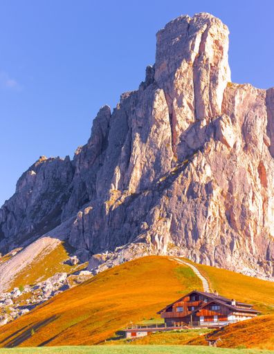 A vertical shot of the alpine lodge at Forcella Giau, Italy