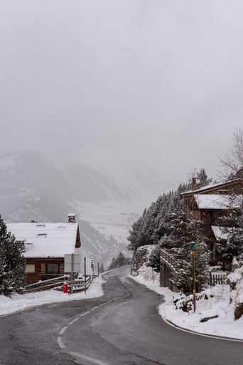 A vertical shot of the street during a snowstorm in the Pyrenees, Andorra