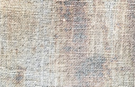 A closeup shot of an aged rough natural woven with copy space