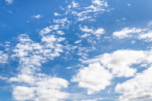 A beautiful view of the fluffy white clouds in the blue sky - great for wallpapers