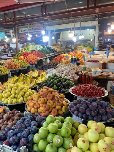 A vertical shot of fresh fruits and vegetables in the market. Nowshahr, Iran.