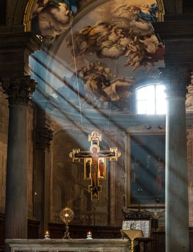 the badia fiorentina (dante’s church) with its presbitery and the holy cross enlighted by sunbeams