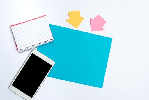 Pinned Variety of Empty Color Paper Sticker Notes Mock Up Used for Content. Paper Notebook Accessories And School Supplies With Mobile Phone