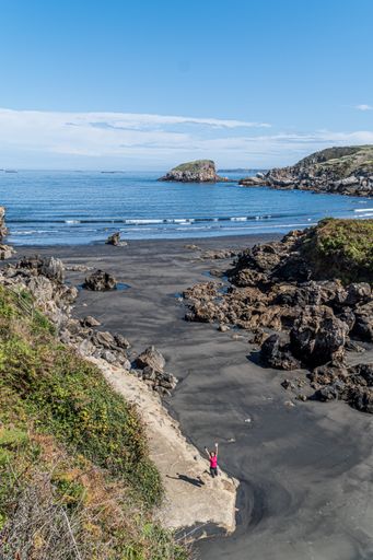 A vertical shot of the seashore with the waterscape in the back, scenic Bay of Biscay, Asturias