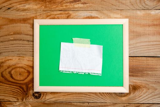 Pinned Variety of Empty Color Paper Sticker Notes Mock Up Used for Content. Paper Notebook Accessories And School Supplies With Mobile Phone