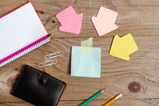 Pinned Variety of Empty Color Paper Sticker Notes Mock Up Used for Content. Paper Notebook Accessories And School Supplies With Mobile Phone