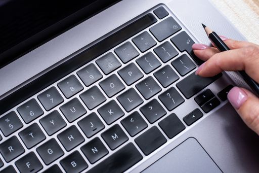 Hands Pointing Pressing Computer Keyboard Keys Typewriting New Ideas. Fingers Tapping Typing Fresh Thoughts Using Wireless Notebook Keypad.