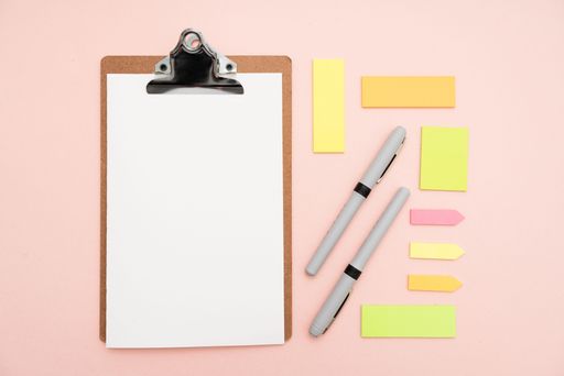 Multiple Assorted Collection Office Stationery Photo With Pens Notepads Notebook Ruler Stapler Scissors Clippers Paper Clips Holders Over Table