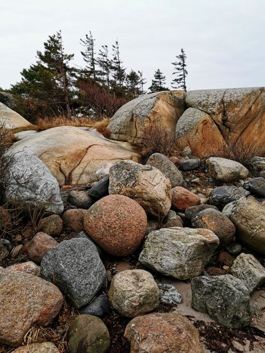 A vertical shot of the huge rocks on the seashore in Ula, Norway