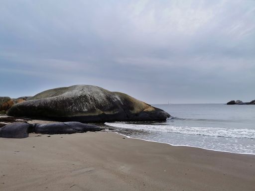 A shot of the coast facing the sea under the cloudy sky in Ula, Norway