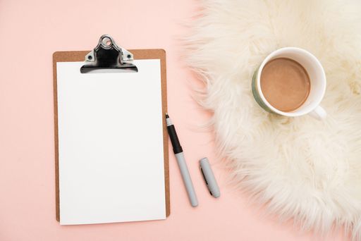 Office Supplies Over Desk With Keyboard And Glasses And Coffee Cup For Working Remotely, Assorted School Utilities With Hot Drink And Eyeglasses.