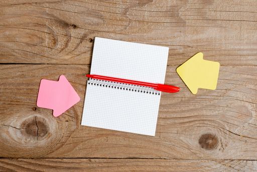 Pinned Variety of Empty Color Paper Sticker Notes Mock Up Used for Content. Paper Notebook Accessories And School Supplies With Mobile Phone