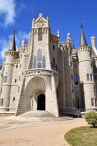 A low angle view of the Episcopal Palace of Astorga by Gaudi on a sunny day