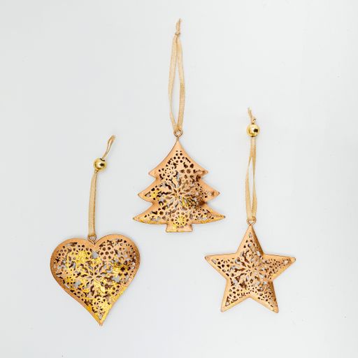 A vertical shot of golden Christmas tree decorations isolated on a white background