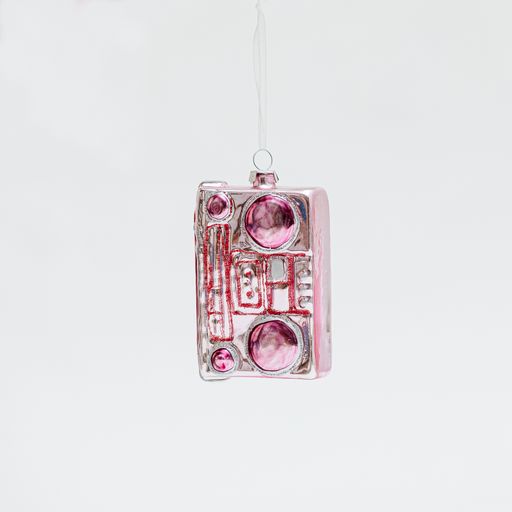 A vertical shot of a shiny Christmas tree toy isolated on a white background