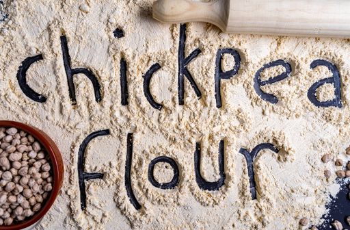 A top view closeup of the chickpeas and chickpea flour on the table