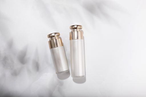 A top view of small glass bottles for cosmetic skincare products