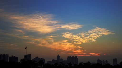 A scenic view of a city skyline during sunset