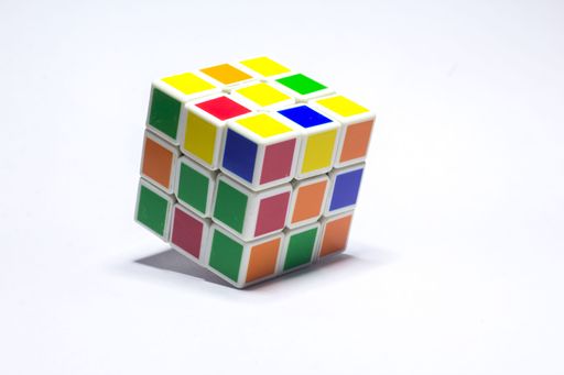 New Delhi, India - Rubik's cube color blue, white, orange, green, yellow on white background with space for text