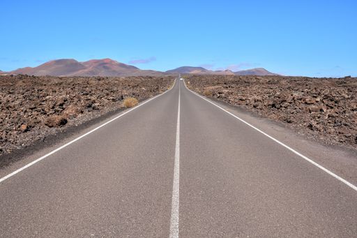 An empty desert asphalt road in Canary Islands Spain
