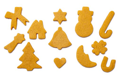 A top view of different shaped Christmas cookies on a white background
