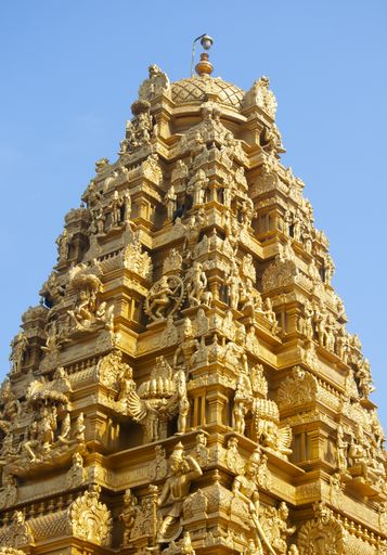 A vertical shot of the Lakshmana Temple in India with beautiful sculptures and statues on the building