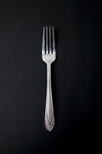 A top view of the fork on a black background