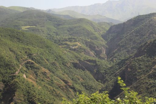 A beautiful shot of the high mountains with trees near the Tatev Monastery in Armenia