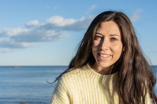 A Caucasian brunette on a beach in Benicasim, Spain
