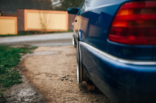 A selective focus shot of a car tire  during the change