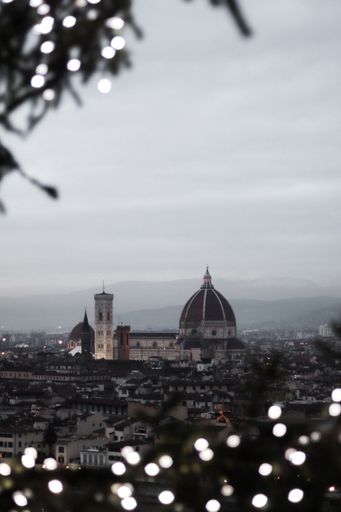 A vertical shot of the Piazzale Michelangelo under a cloudy sky in Italy