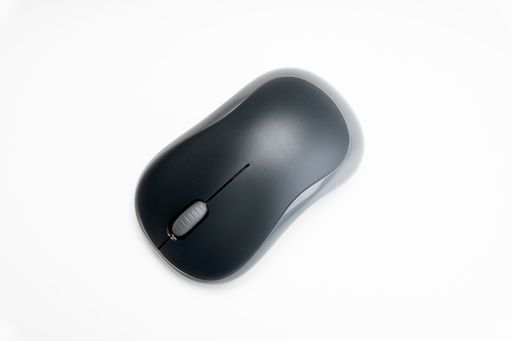 A closeup shot of a wireless mouse on a white background