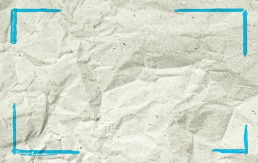 A blue framed recycled crumpled paper sheet with copy space