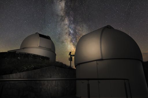 A low angle shot of a solar observatory with a view of the beautiful milkyway