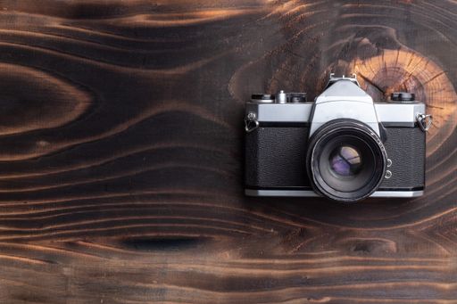 A top view of a professional camera on the table