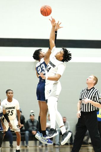 A vertical shot of young male players on the court at a fall Indiana high school basketball game