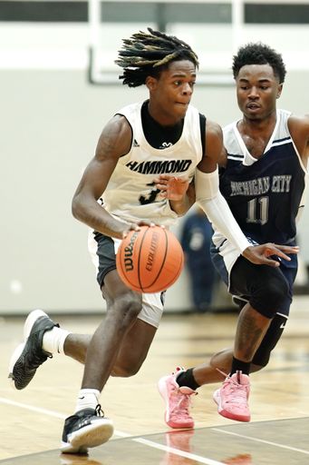 A vertical shot of young male players on the court at a fall Indiana high school basketball game